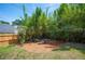 Backyard play area with mulch ground cover and bamboo privacy landscaping at 112 Hiawatha Trl, Lakeland, FL 33803