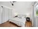 Bright bedroom features light wood floors, neutral linens, and natural light at 112 Hiawatha Trl, Lakeland, FL 33803