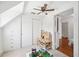 Bright bedroom with a sloped ceiling, ample closet space, and fan at 112 Hiawatha Trl, Lakeland, FL 33803