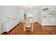 Cozy dining room features hardwood floors, a large table, and built-in storage at 112 Hiawatha Trl, Lakeland, FL 33803