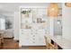 Charming living area featuring custom built-ins, hardwood floors, and an inviting atmosphere at 112 Hiawatha Trl, Lakeland, FL 33803