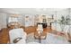 Open-concept living room leading to a modern kitchen and dining area with ample natural light at 112 Hiawatha Trl, Lakeland, FL 33803