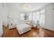 Bright living room featuring a large white sofa, fireplace, and lots of natural light at 112 Hiawatha Trl, Lakeland, FL 33803