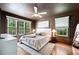 Stylish main bedroom features large windows, hardwood floors, and ample natural light at 112 Hiawatha Trl, Lakeland, FL 33803