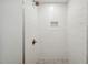 Bright shower features white subway tile and brushed gold fixtures at 112 Hiawatha Trl, Lakeland, FL 33803