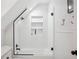 Modern shower with white tile, glass door and shelving at 112 Hiawatha Trl, Lakeland, FL 33803