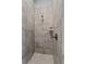 Tiled walk-in shower featuring a shower head and tile flooring at 117 Palmola St, Lakeland, FL 33803