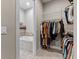 Bathroom with a tub next to the closet with wire shelves at 117 Palmola St, Lakeland, FL 33803
