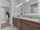 Bathroom featuring double vanity and decorative flowers at 117 Palmola St, Lakeland, FL 33803