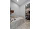 Bathroom showcasing a built-in tub and walk-in closet at 117 Palmola St, Lakeland, FL 33803