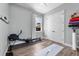 Spare bedroom with exercise machine and double closet at 117 Palmola St, Lakeland, FL 33803