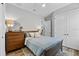 Bedroom featuring a bed, dresser, nightstand, and ceiling fan at 117 Palmola St, Lakeland, FL 33803