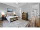 Spacious bedroom with hardwood floors, neutral tones, and ample natural light at 117 Palmola St, Lakeland, FL 33803