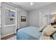 Bedroom featuring a window, ceiling fan, and bed at 117 Palmola St, Lakeland, FL 33803