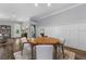 Bright dining area with hardwood floors, wainscoting, and a modern table set for dinner at 117 Palmola St, Lakeland, FL 33803