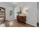 Bright entryway with hardwood floors, console table, and direct access to the outdoors at 117 Palmola St, Lakeland, FL 33803