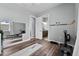 Bright home gym with mirrored wall, hard wood floors, and athletic equipment at 117 Palmola St, Lakeland, FL 33803