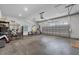 Spacious garage featuring lots of room, tools, and a weight-lifting area at 117 Palmola St, Lakeland, FL 33803