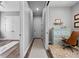 Hallway with doors leading to other rooms and rug running the length of the hall at 117 Palmola St, Lakeland, FL 33803