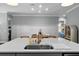 Large kitchen island features a sink and plenty of counter space, perfect for meal prep and entertaining at 117 Palmola St, Lakeland, FL 33803
