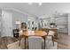 Well-lit kitchen connects to the dining area with a kitchen island and modern finishes throughout at 117 Palmola St, Lakeland, FL 33803