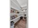 Spacious walk-in pantry with ample shelving, perfect for organization and storage of food at 117 Palmola St, Lakeland, FL 33803