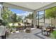 Bright patio with patio furniture, pavers, and potted plants at 117 Palmola St, Lakeland, FL 33803