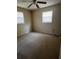 Empty bedroom featuring neutral walls, carpet, and two windows allowing ample natural light at 1226 N Brunnell Pkwy, Lakeland, FL 33805