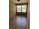 A dining area features tiled flooring and natural light from large windows with blinds at 1226 N Brunnell Pkwy, Lakeland, FL 33805