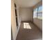 Bright sunroom featuring large windows and built-in shelving at 1226 N Brunnell Pkwy, Lakeland, FL 33805