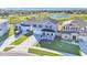 Aerial view of a beautiful two story home, featuring a manicured lawn and a scenic backdrop at 1280 Denali Dr, Winter Haven, FL 33880