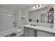 Clean bathroom featuring modern vanity, shower-tub, and bright white decor at 1280 Denali Dr, Winter Haven, FL 33880