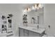Bathroom with double sink vanity, drawers for storage, and bright lighting at 1280 Denali Dr, Winter Haven, FL 33880