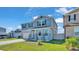 Two-story home featuring beautiful curb appeal, manicured lawn, and inviting outdoor space at 1280 Denali Dr, Winter Haven, FL 33880