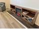 Attractive electric fireplace with wooden surround and built-in shelving at 1280 Denali Dr, Winter Haven, FL 33880