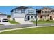 Well-maintained two-story home showcasing a two-car garage and inviting front yard at 1280 Denali Dr, Winter Haven, FL 33880