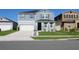 Beautiful two-story home with a two-car garage, featuring a well-kept lawn and tidy landscaping at 1280 Denali Dr, Winter Haven, FL 33880