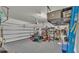 Organized garage with shelving, storage, and ample space for parking and projects at 1280 Denali Dr, Winter Haven, FL 33880