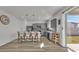 Modern kitchen with gray cabinets, stainless steel appliances, an island, and backyard access at 1280 Denali Dr, Winter Haven, FL 33880