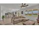 Open-concept living space featuring modern furniture, a view to the kitchen, and natural light at 1280 Denali Dr, Winter Haven, FL 33880