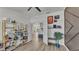 Office space featuring shelving and an open layout into the hallway at 1280 Denali Dr, Winter Haven, FL 33880