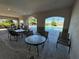 Covered seating area provides a relaxing poolside view in a well-maintained community at 1280 Denali Dr, Winter Haven, FL 33880