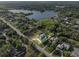 Stunning aerial view showcasing the property's location near a serene lake surrounded by lush greenery at 13137 Lake Butler Blvd, Windermere, FL 34786