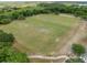 Aerial shot of a soccer field surrounded by trees, offering a recreational space for the community at 13137 Lake Butler Blvd, Windermere, FL 34786