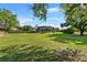 Large grassy backyard with a screened-in lanai, perfect for outdoor activities and relaxation at 13137 Lake Butler Blvd, Windermere, FL 34786