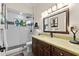 Elegant bathroom with a glass-enclosed shower, luxurious vanity, and modern fixtures at 13137 Lake Butler Blvd, Windermere, FL 34786