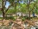 Tranquil park view with benches, trees, and Centennial celebration banner, inviting relaxation at 13137 Lake Butler Blvd, Windermere, FL 34786