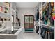 Bright walk-in closet with extensive shelving, natural light, and a comfortable, cushioned seat at 13137 Lake Butler Blvd, Windermere, FL 34786