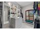 Bright walk-in closet with extensive shelving, natural light, and a comfortable, cushioned seat at 13137 Lake Butler Blvd, Windermere, FL 34786