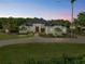 Stunning home featuring mature landscaping, circular driveway, and a metal roof at 13137 Lake Butler Blvd, Windermere, FL 34786